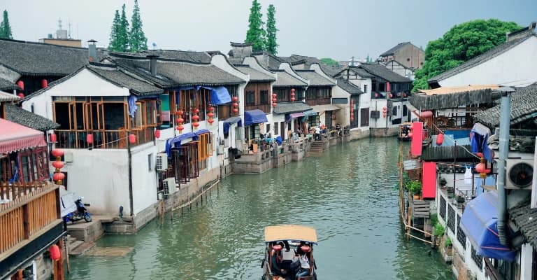 Traditional Chinese water town with canals, stone bridges, and historic houses