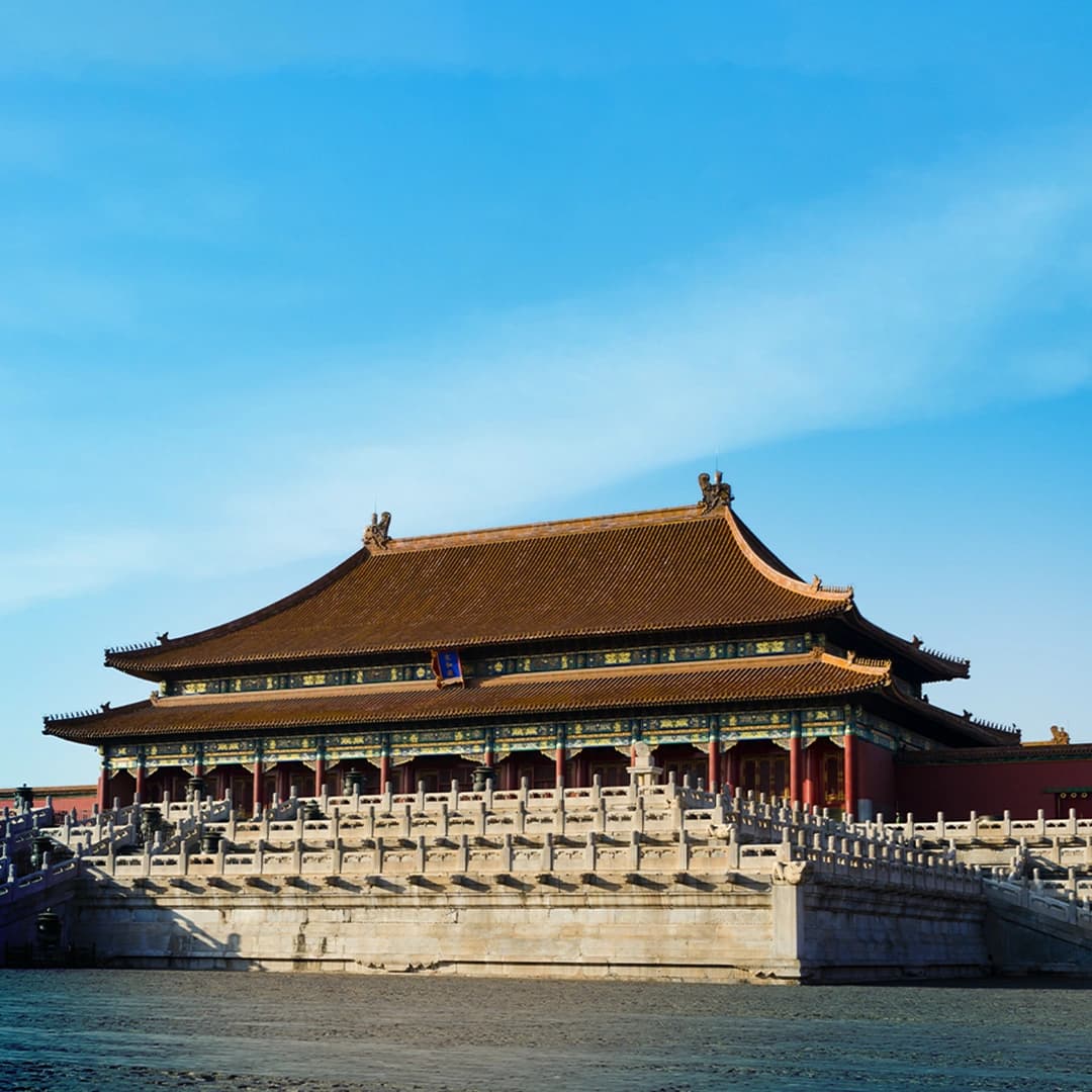Forbidden City Beijing with traditional Chinese palace buildings, red walls, and golden roofs