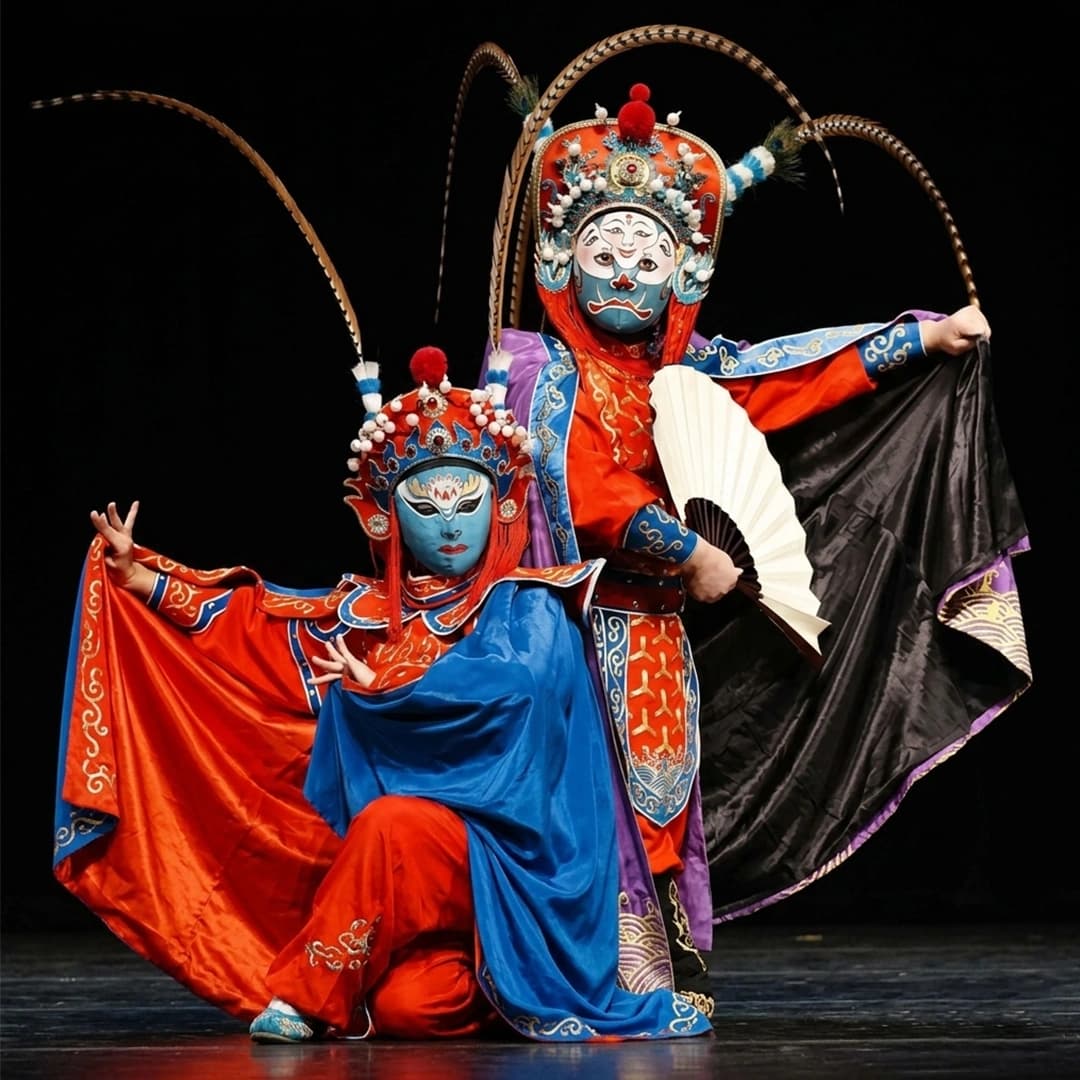 Sichuan Opera face-changing performance with colorful costumes and dramatic mask transformation on stage