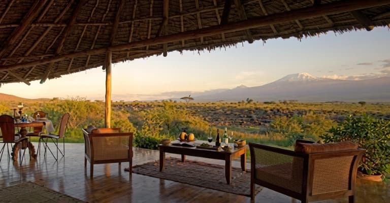 Luxury safari lodge in Kenya overlooking wildlife-rich savannah offering premium safari experience