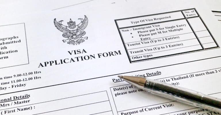 Passport and travel documents for a Thailand trip