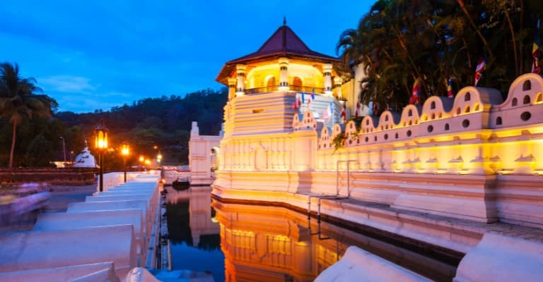 Temple of the Tooth Relic in Kandy with lake and surrounding hills in Sri Lanka