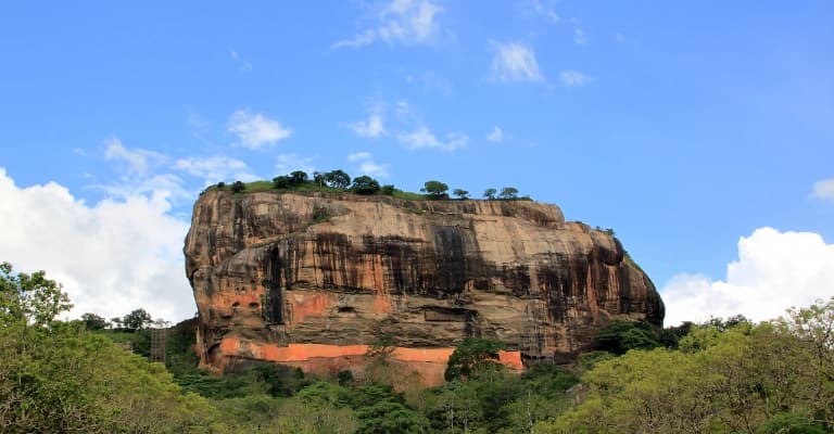 Sigiriya Lion Rock fortress rising above jungle landscape in Sri Lanka