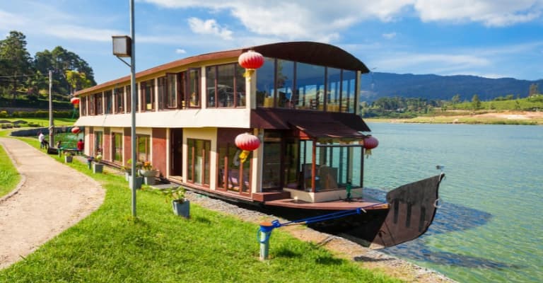 Tea plantations in Nuwara Eliya with rolling green hills and misty climate
