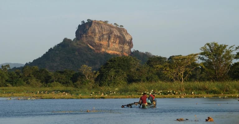 Scenic train journey in Sri Lanka passing through tea plantations and hills near Ella