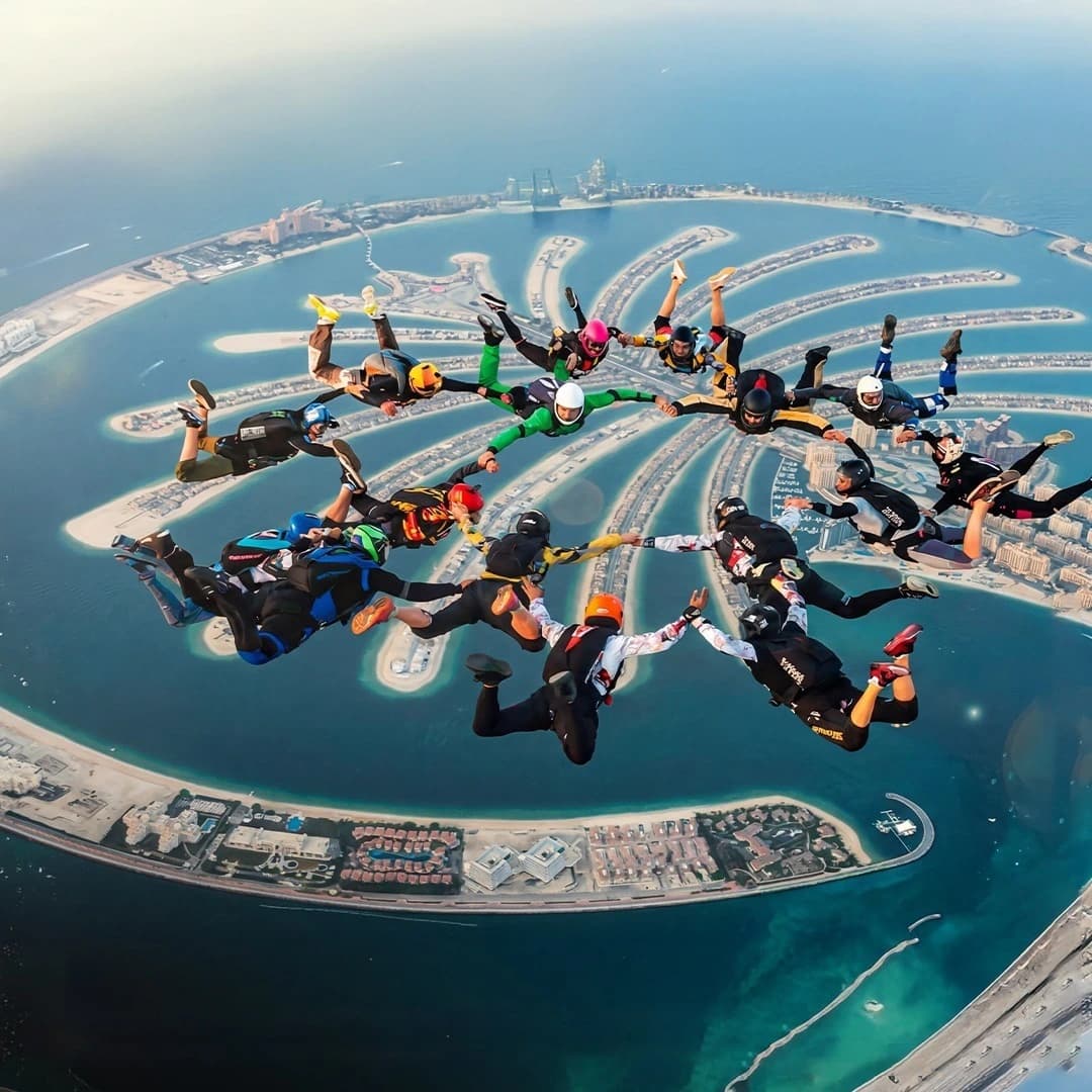 Skydiving over Palm Jumeirah with aerial view of Dubai coastline