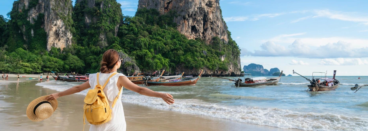 Thailand travel banner featuring temples, tropical islands, and iconic attractions