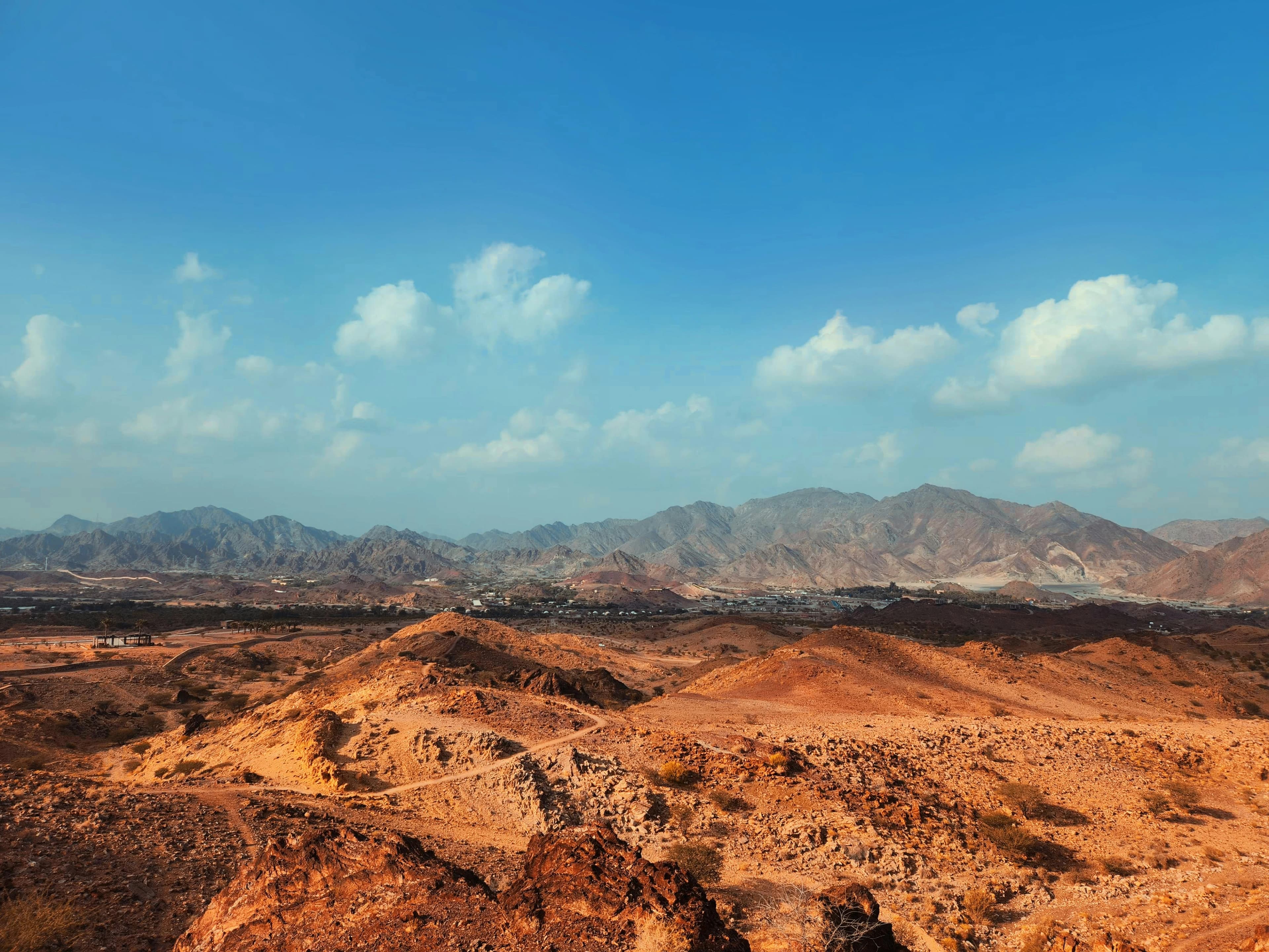 Hatta mountains landscape with kayaking lake and rugged terrain