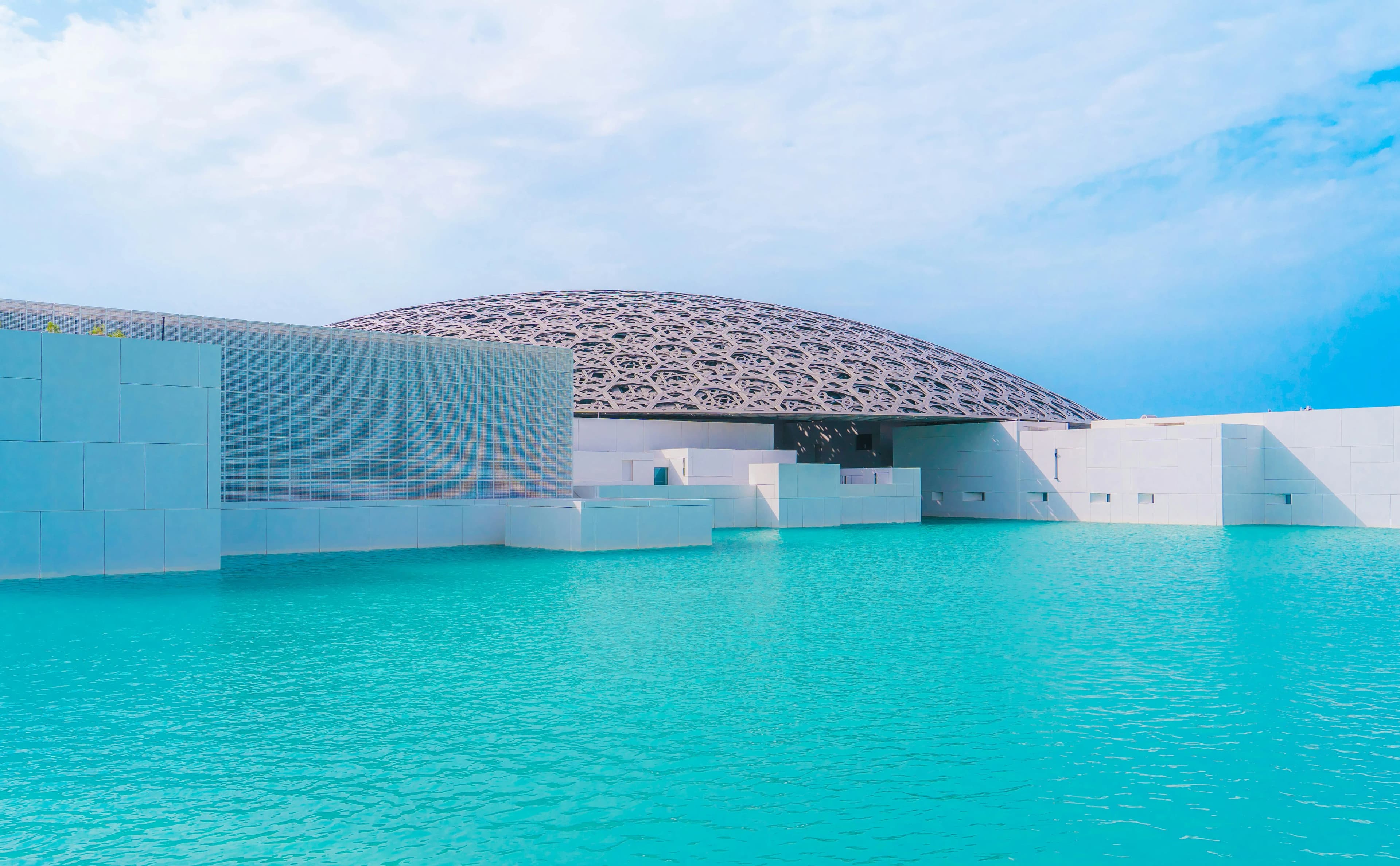 Louvre Abu Dhabi museum exterior with iconic dome architecture on Saadiyat Island