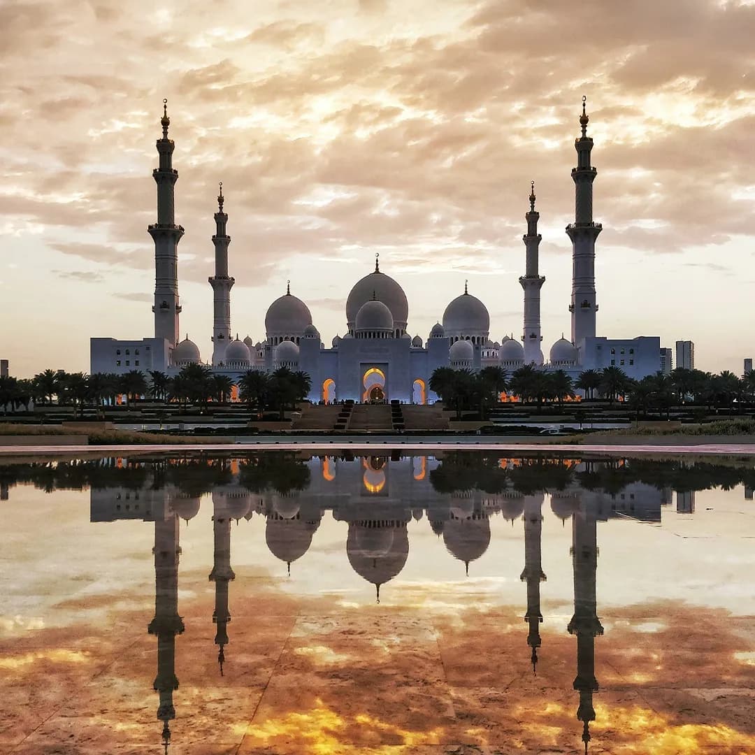 Sheikh Zayed Grand Mosque with white marble domes and reflective pools in Abu Dhabi
