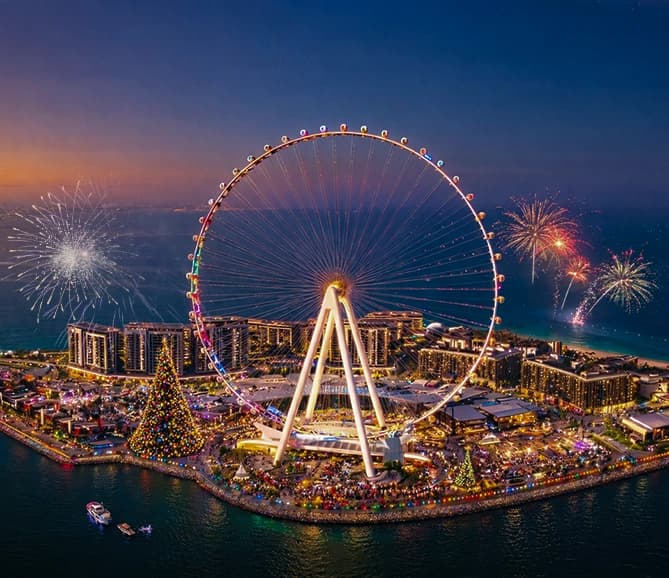 Fireworks display over Dubai skyline during New Year celebrations with bright colorful bursts