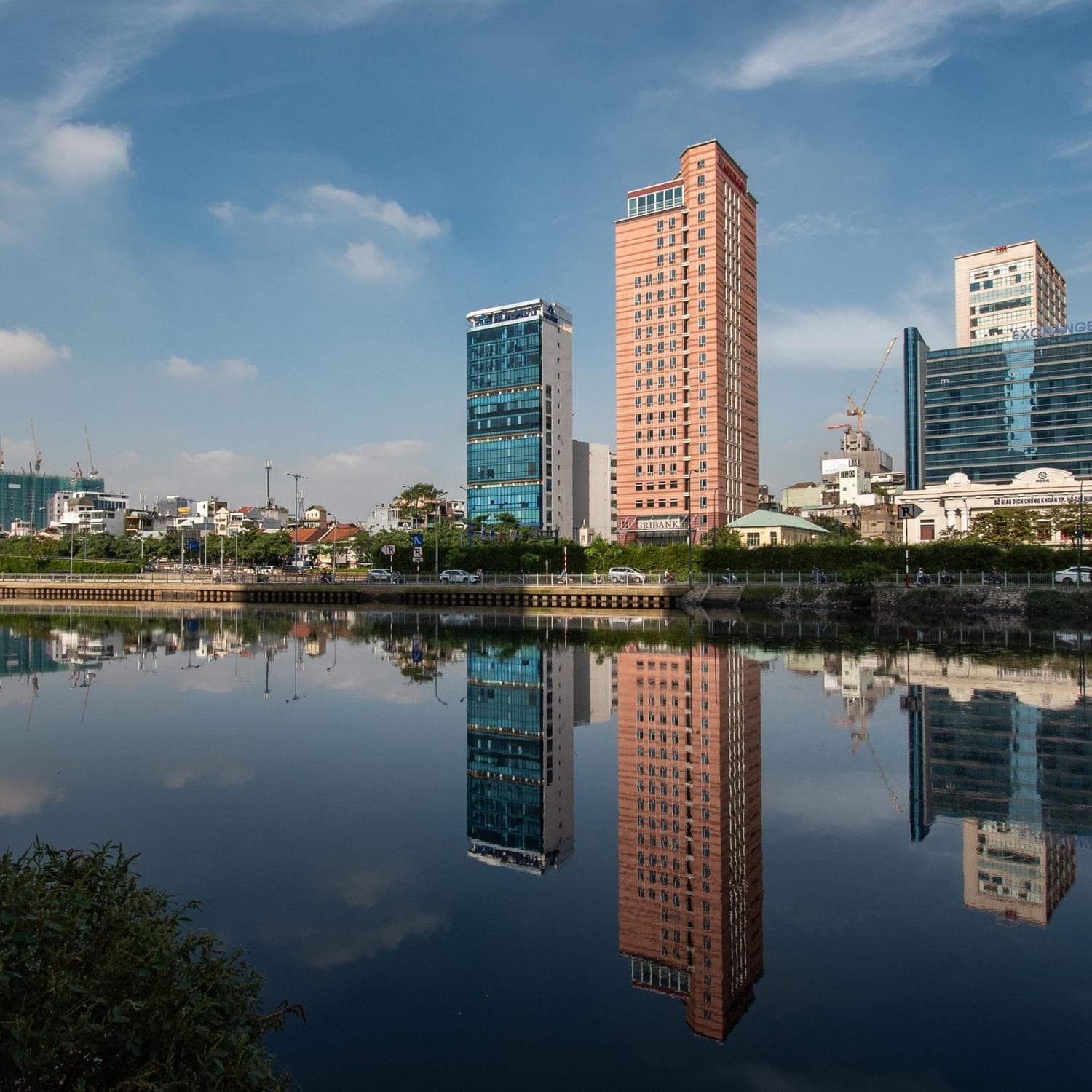 Modern skyline and bustling urban streets in Ho Chi Minh City, Vietnam