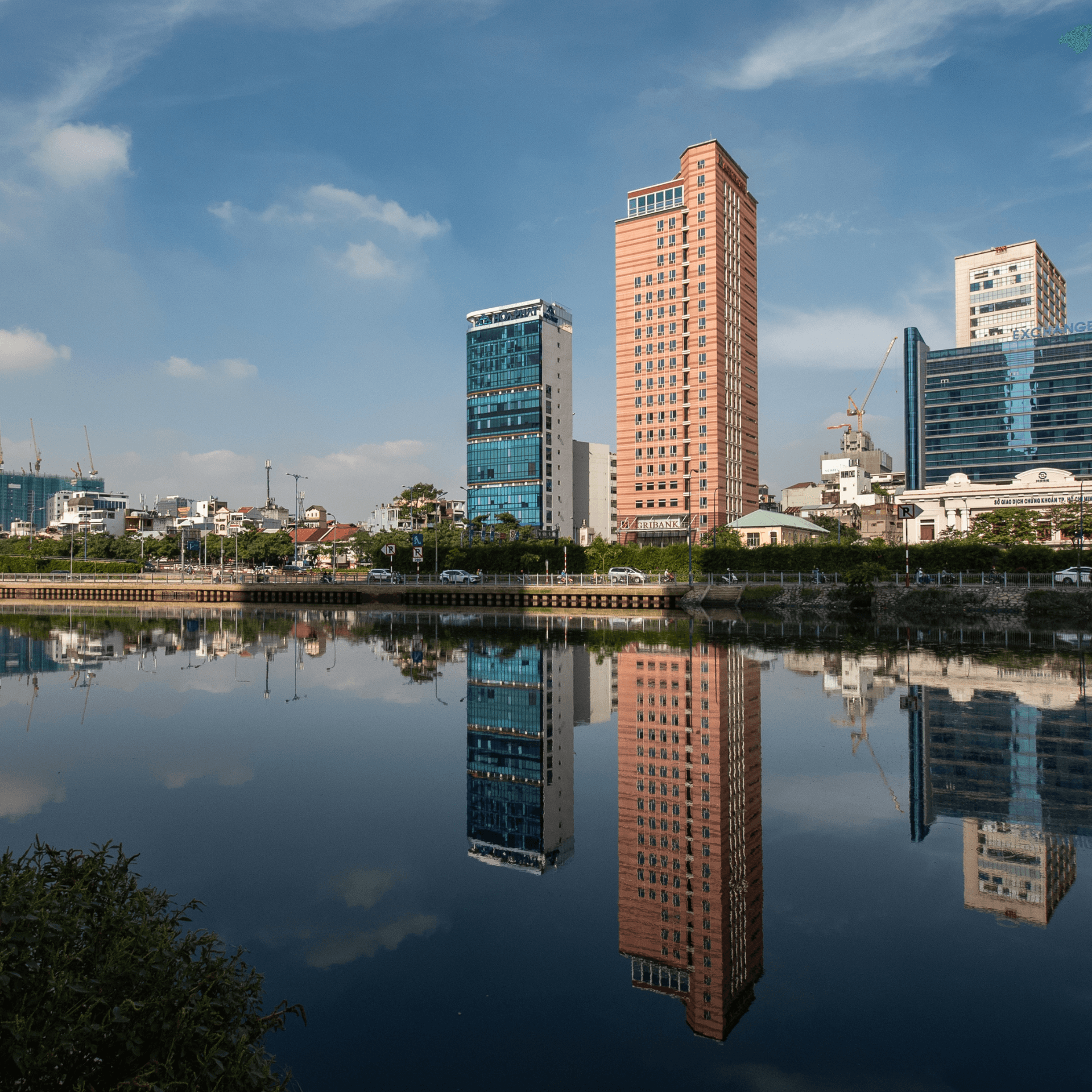 Modern skyline and bustling urban streets in Ho Chi Minh City, Vietnam
