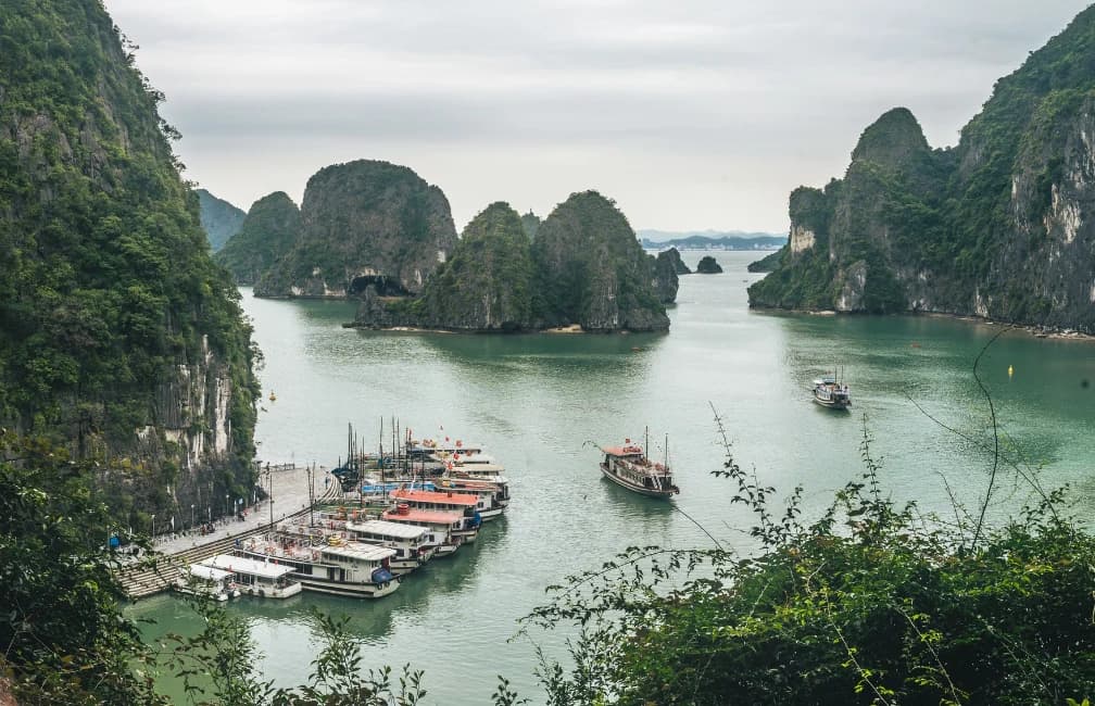 Limestone islands and cruise boats in Halong Bay, Vietnam