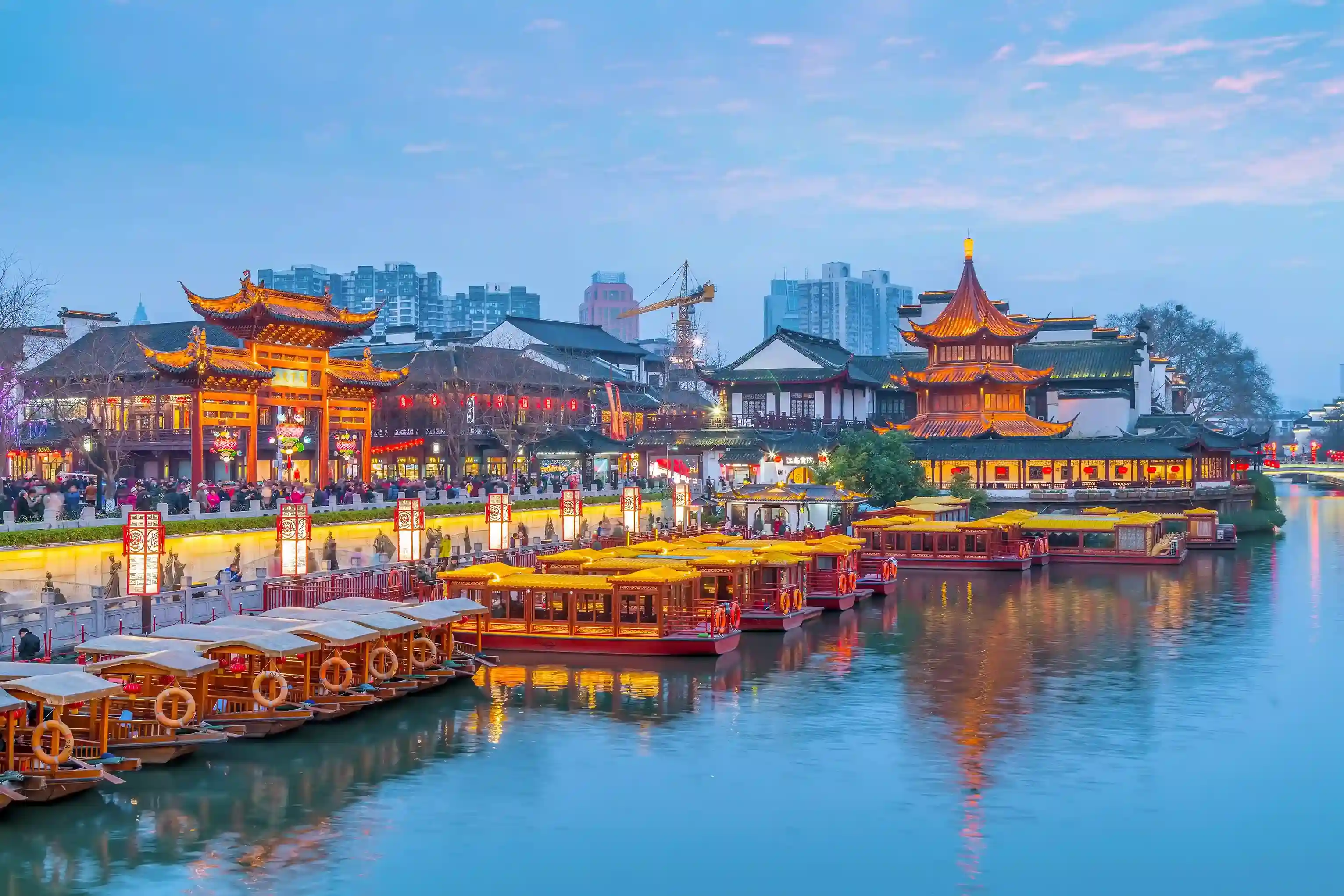 Panoramic view of the Great Wall of China stretching over green mountains, highlighting hidden and iconic travel experiences for China tours